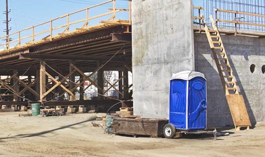 the convenience of on-site restrooms a job site lined with portable toilets